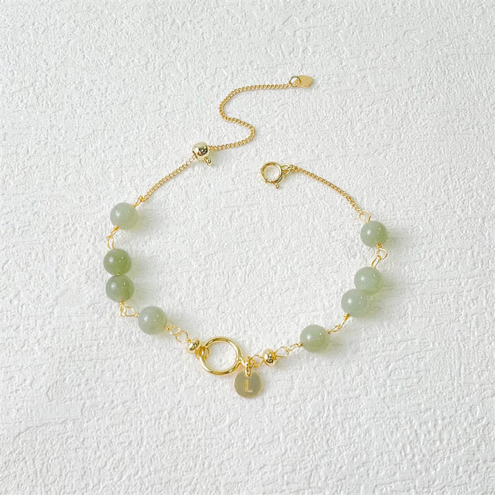 Bracelet porte-bonheur en perles de jade Hetian naturel unique de Buddha Stones rempli d'or 14 carats