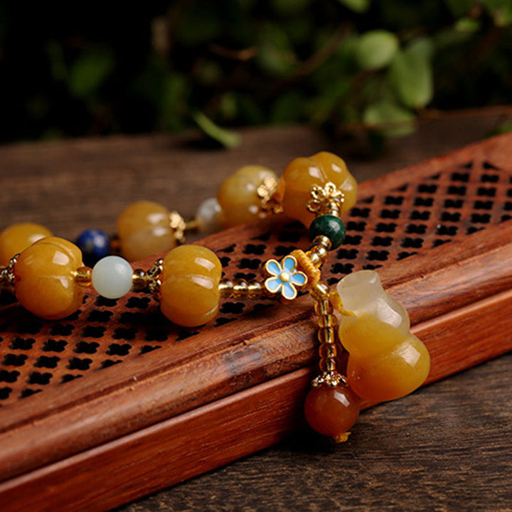 Bracelet de richesse Pixiu en jade et soie dorée avec Buddha Stones