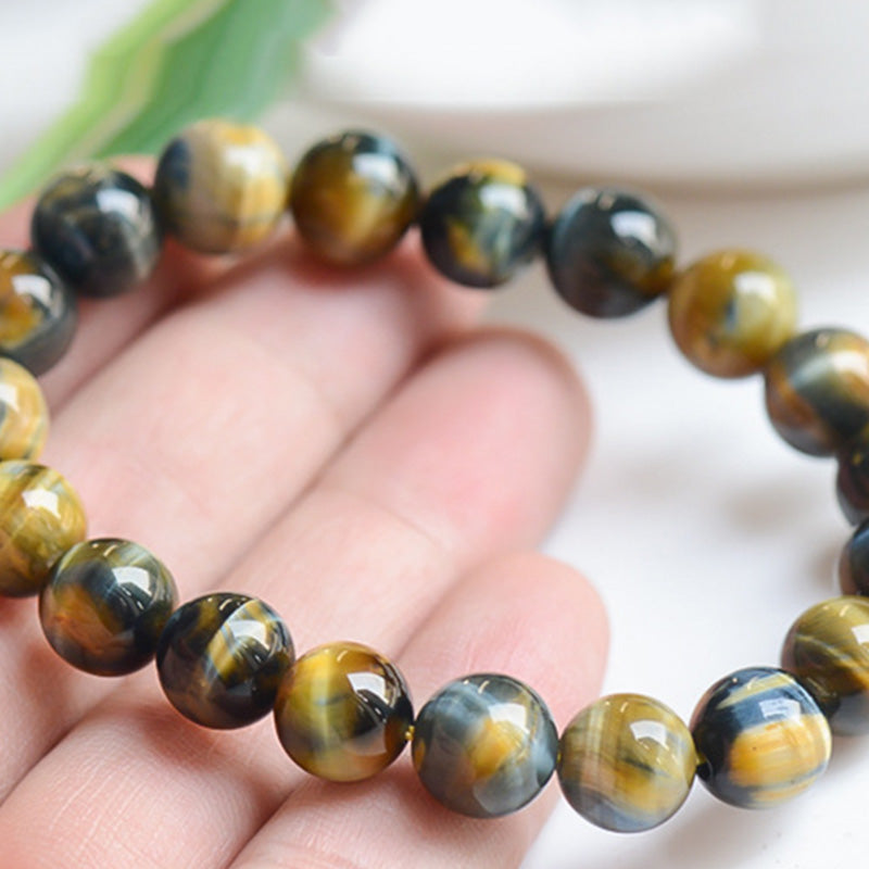 Bracelet de force, de courage et de protection en œil de tigre avec Buddha Stones