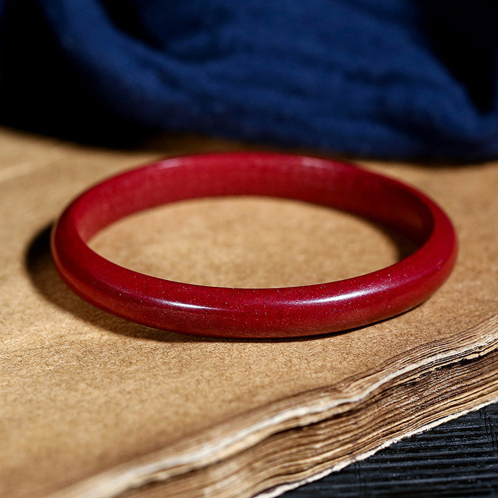 Bracelet jonc de bénédiction gravé du Sutra du cœur en Buddha Stones en cinabre