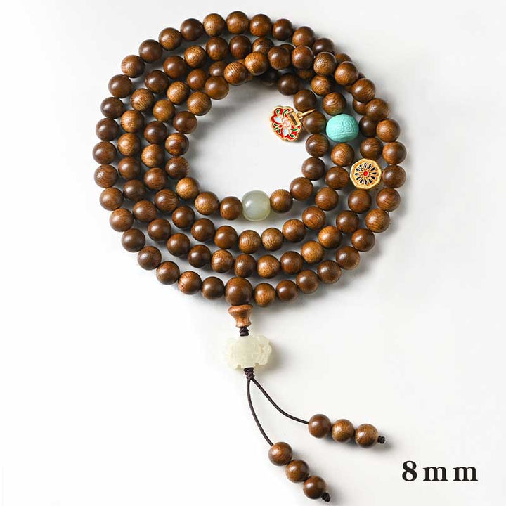 Bracelet Mala tibétain de protection et de calme en bois de rose avec Buddha Stones