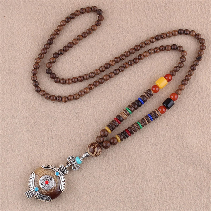 Collier pendentif protection éléphant en Buddha Stones tibétain en bois de wengé Bodhi Seed Agate