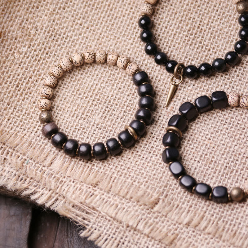 Bracelet de paix en cuivre et bois d'ébène avec Buddha Stones et graines de Bodhi tibétaines