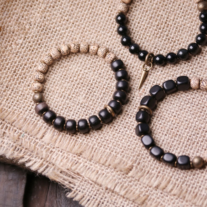 Bracelet de paix en cuivre et bois d'ébène avec Buddha Stones et graines de Bodhi tibétaines