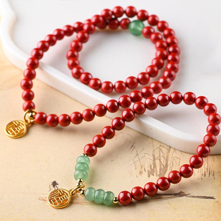 Collier porte-bonheur tibétain en aventurine verte et cinabre avec Buddha Stones