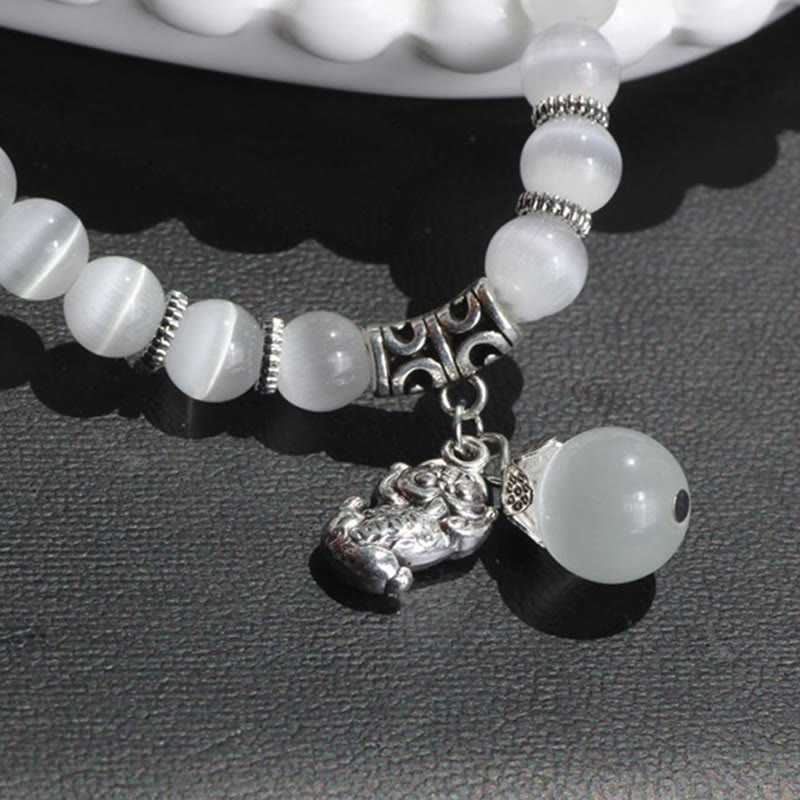 Bracelet triple tour de soutien PiXiu œil de chat en Buddha Stones