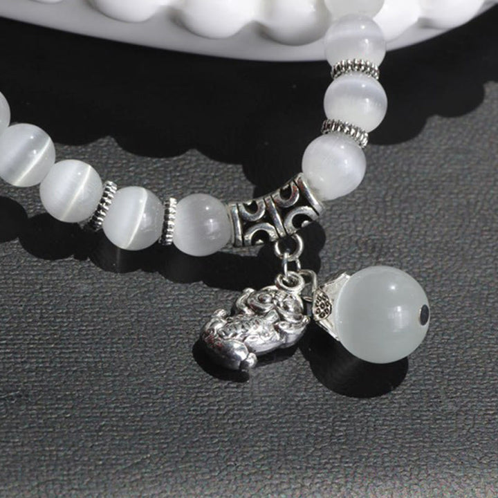 Bracelet triple tour de soutien PiXiu œil de chat en Buddha Stones