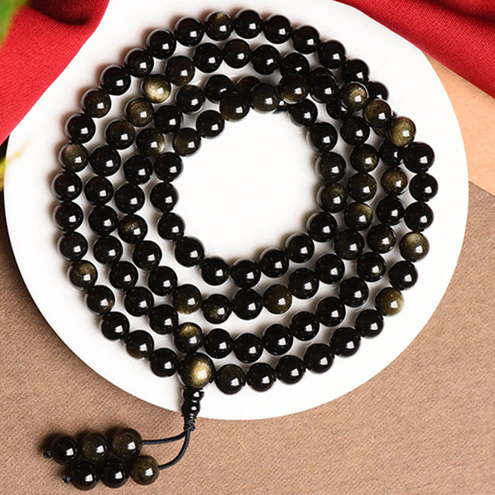 Bracelet de richesse en obsidienne naturelle dorée avec 108 perles de Mala Buddha Stones