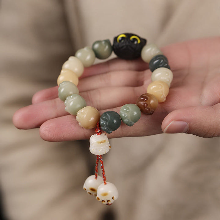 Bracelet de sagesse porte-bonheur en bois d'ébène avec de belles pattes et des graines de Bodhi naturelles de Buddha Stones - image 11