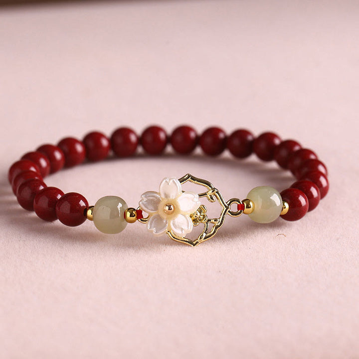 Bracelet de bénédiction en pierre de cinabre naturelle et jade Tridacna avec Buddha Stones