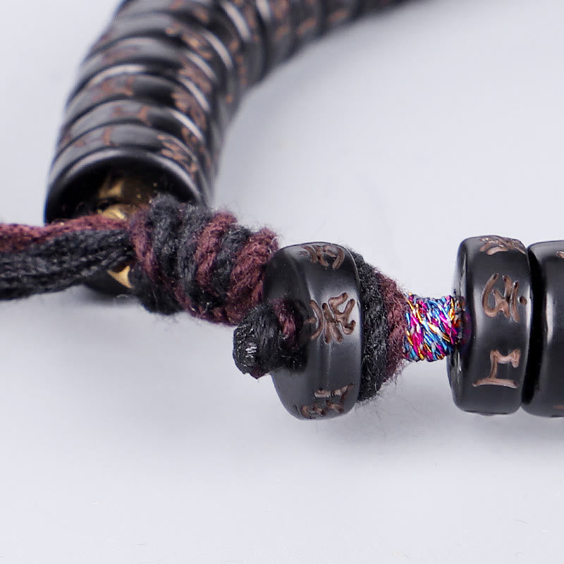 Bracelet en corde Buddha Stones perles de noix de coco tibétaines gravées avec le mantra positif Om Mani Padme Hum