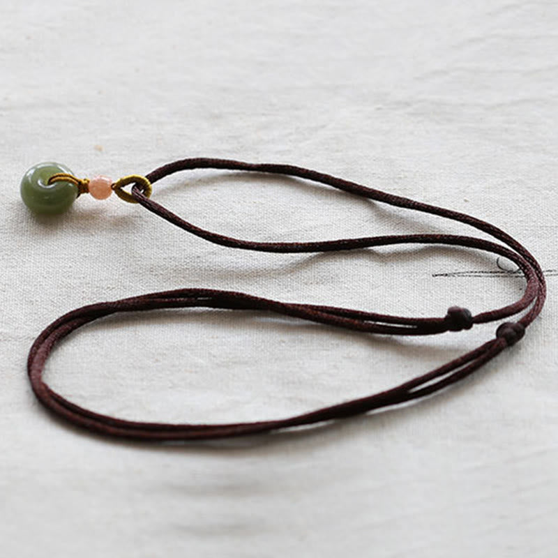 Collier avec pendentif en jade rond naturel et Buddha Stones, boucle de paix, lotus d'abondance - image 12