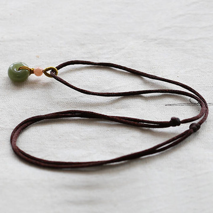 Collier avec pendentif en jade rond naturel et Buddha Stones, boucle de paix, lotus d'abondance - image 12