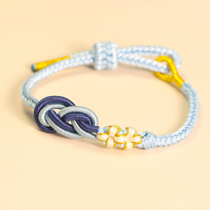 Bracelet de connexion porte-bonheur en forme de nœud de paix à huit fils fabriqué à la main par Buddha Stones