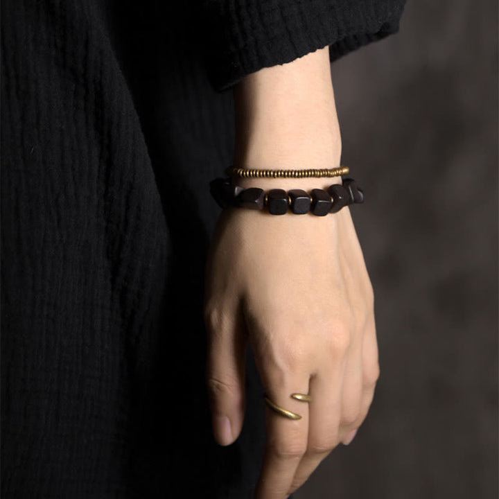 Bracelet double tour en cuivre et bois d'ébène tibétain avec Buddha Stones
