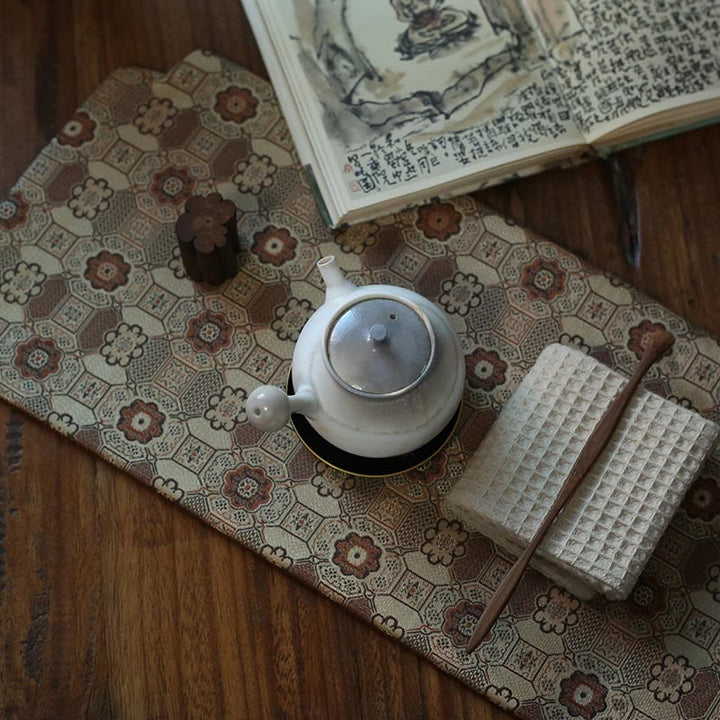 Dessous de verre élégant à motif de brocart floral pour tasse à thé