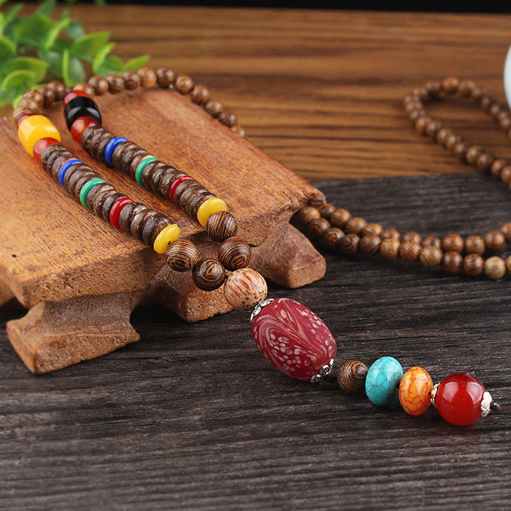 Collier pendentif en Buddha Stones tibétain en bois de wengé Bodhi Seed Agate Balance Peace