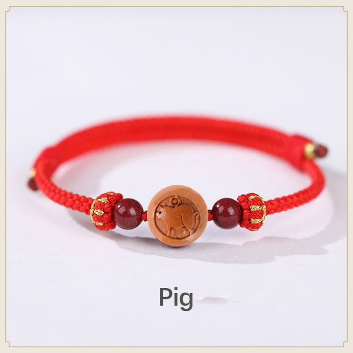 Bracelet de richesse en bois de pêche naturel Buddha Stones et caractère Fu du zodiaque chinois sculpté en cinabre