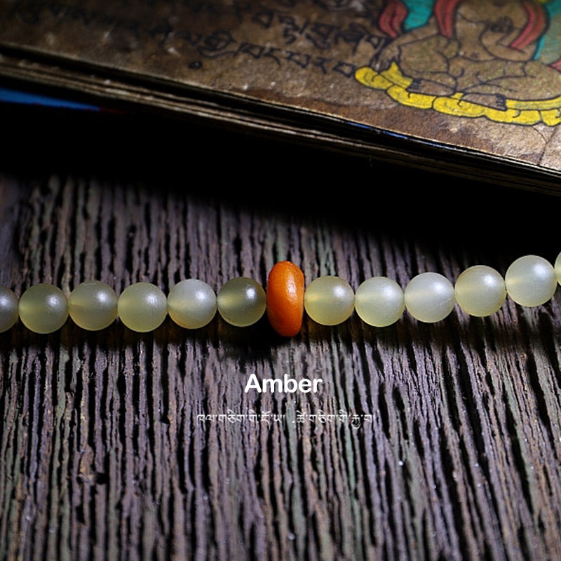 Bracelet porte-bonheur en ambre avec 108 Buddha Stones de Mala en corne de mouton du Tibet