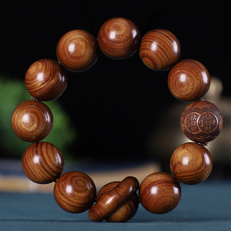 Bracelet apaisant sculpté en bois de rose, santal vert, ébène et cuivre, orné de Buddha Stones et du zodiaque chinois - Palissandre - image 1