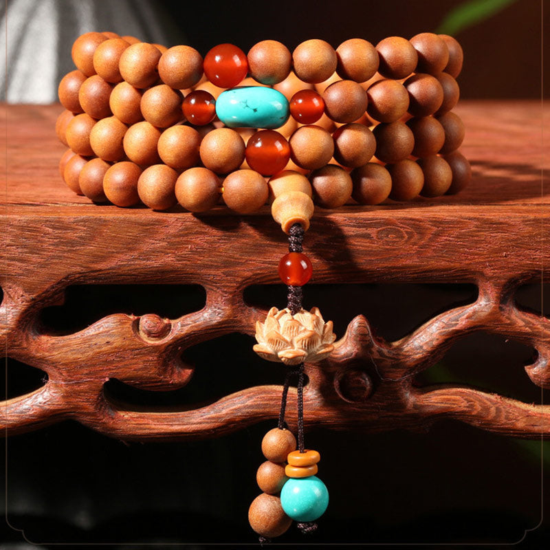 Bracelet Mala à breloques tibétaines en bois de santal et lotus avec Buddha Stones