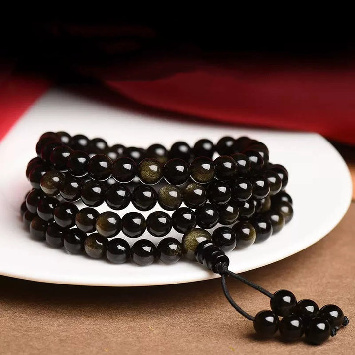 Bracelet de richesse en obsidienne naturelle dorée avec 108 perles de Mala Buddha Stones