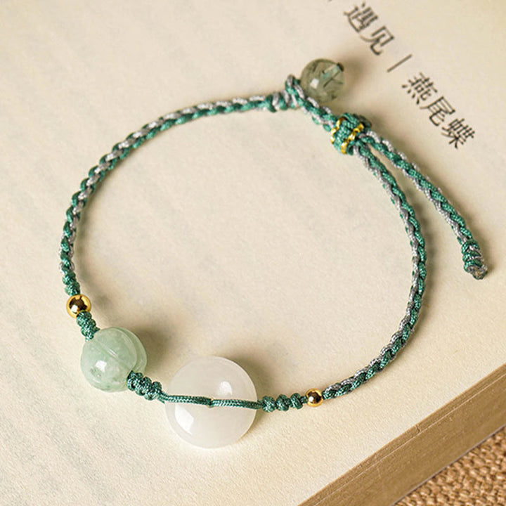 Bracelet tressé en jade blanc avec boucle de paix et perles citrouilles et Buddha Stones