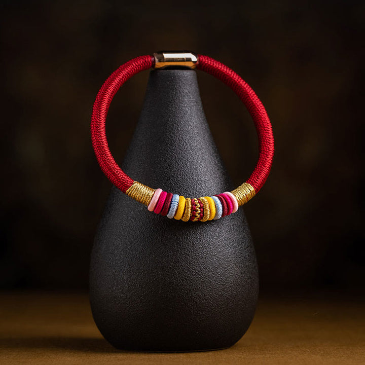 Bracelet tressé à boucle magnétique en Buddha Stones tibétaines fait à la main avec protection des nœuds King Kong