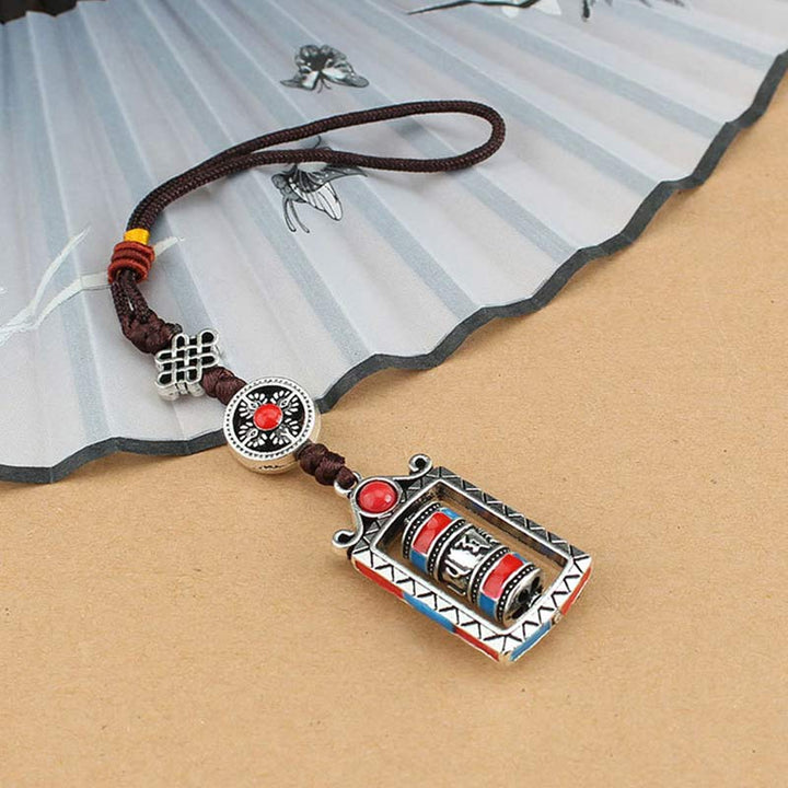 Porte-clés décoratif avec nœud rotatif et bénédiction en forme de roue de prière en six mots vrais en Buddha Stones