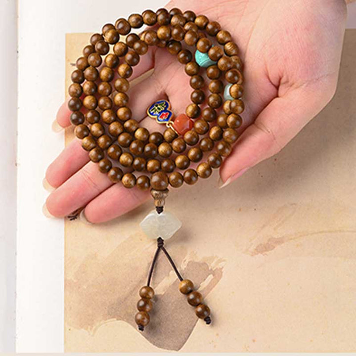 Bracelet Mala tibétain de protection et de calme en bois de rose avec Buddha Stones