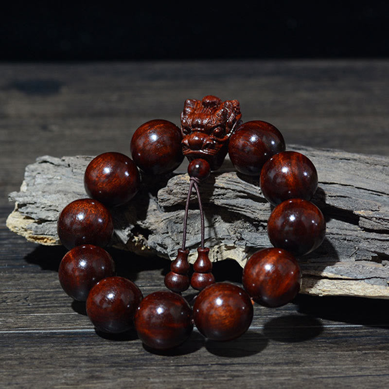 Bracelet de protection sculpté en forme de dragon en bois de santal vert et bois de rose avec petites feuilles de Buddha Stones
