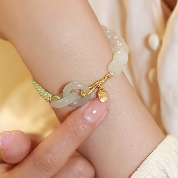 Bracelet tressé en perles de jade Hetian naturelles de Buddha Stones avec boucle de paix double et caractère Fu