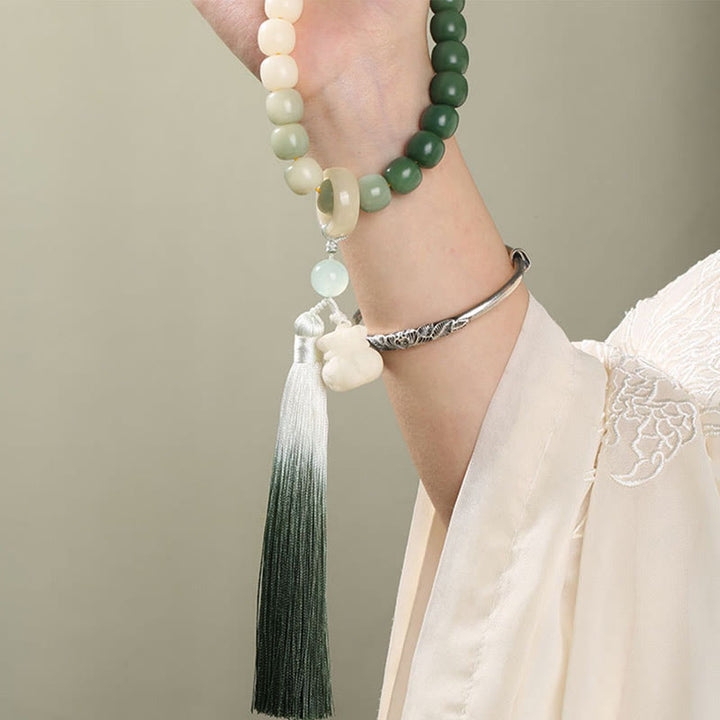 Buddha Stones Dégradé Naturel Graine de Bodhi Fortune Sac d'Argent Sagesse de Lotus Gland Poignet Mala