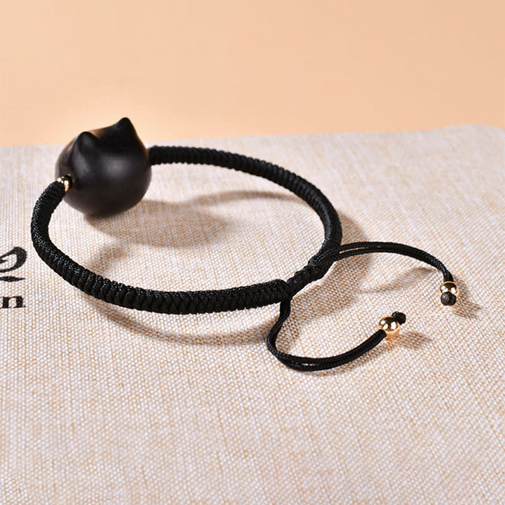 Bracelet tressé en bois d'ébène avec tête de chat et Buddha Stones - image 17