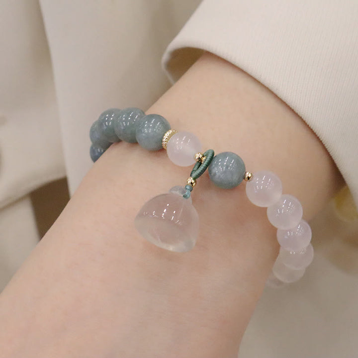 Bracelet de protection avec boucle de paix en Buddha Stones et jade blanc et fleur de lotus