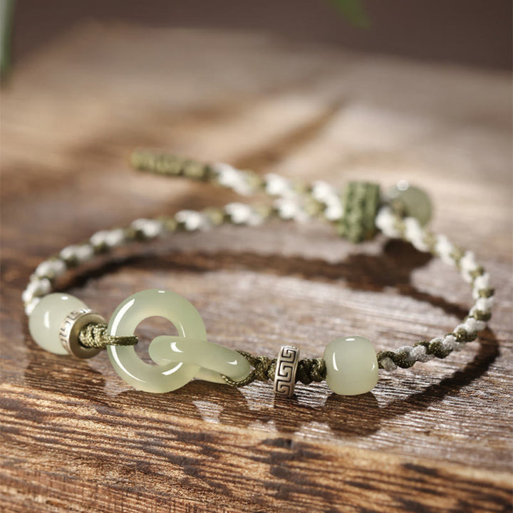 Bracelet tressé avec boucle de paix et porte-bonheur en jade naturel Hetian de Buddha Stones