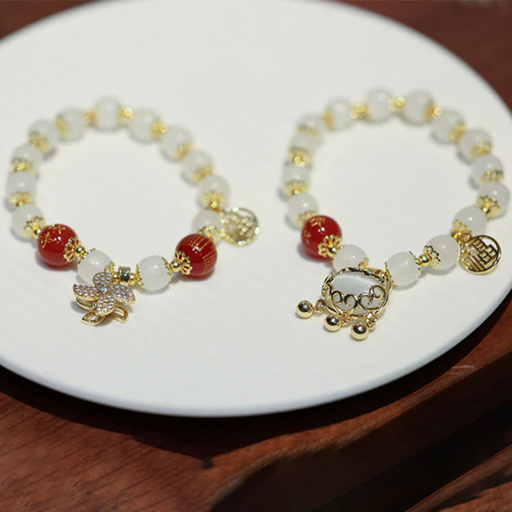Bracelet de bénédiction avec breloque en forme de moulin à vent en Buddha Stones et caractère Fu