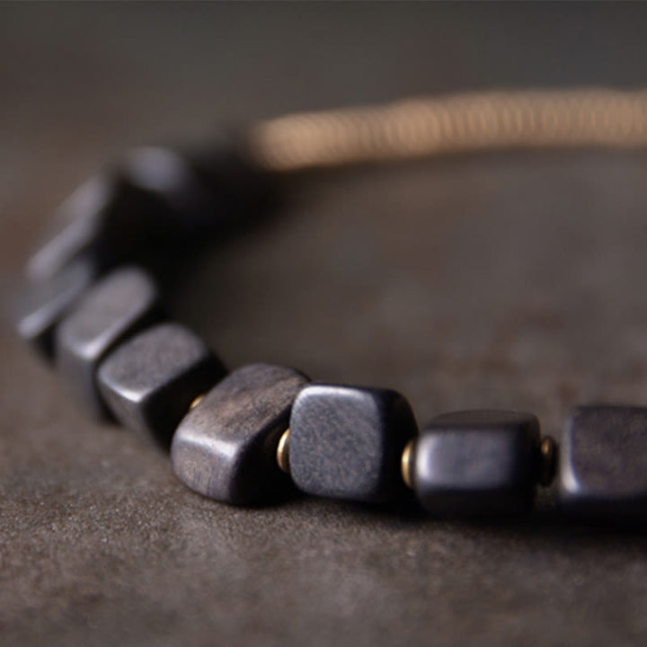 Bracelet double tour en cuivre et bois d'ébène tibétain avec Buddha Stones