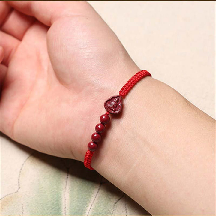 Bracelet en cordon de bénédiction en cinabre Bouddha rieur Avalokitesvara de Buddha Stones