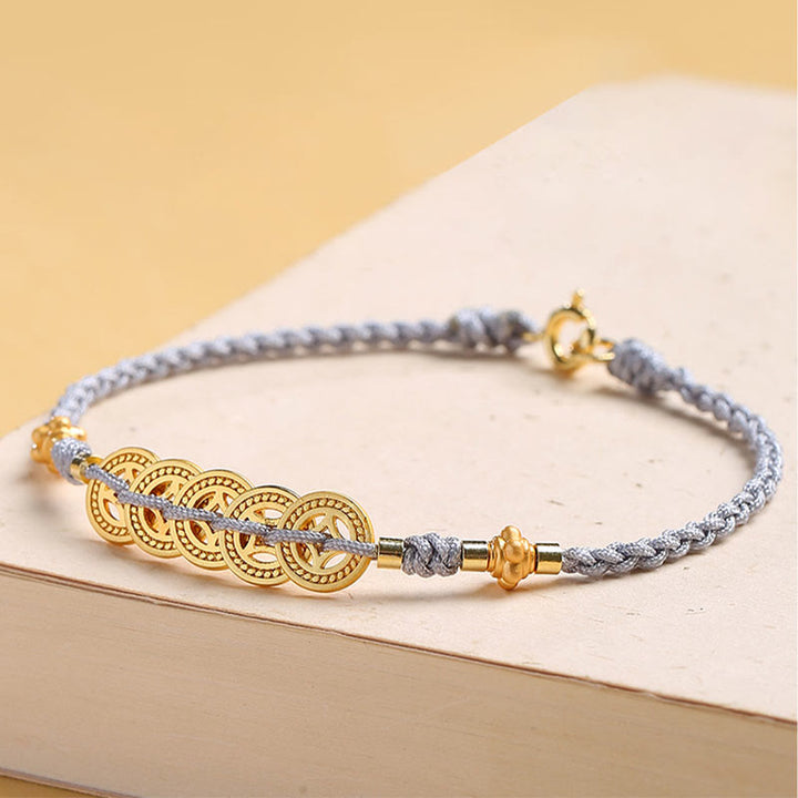 Bracelet tressé en corde bleue avec perles et arbre de fortune en cuivre et Buddha Stones