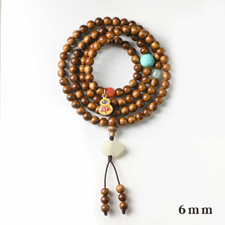 Bracelet Mala tibétain de protection et de calme en bois de rose avec Buddha Stones