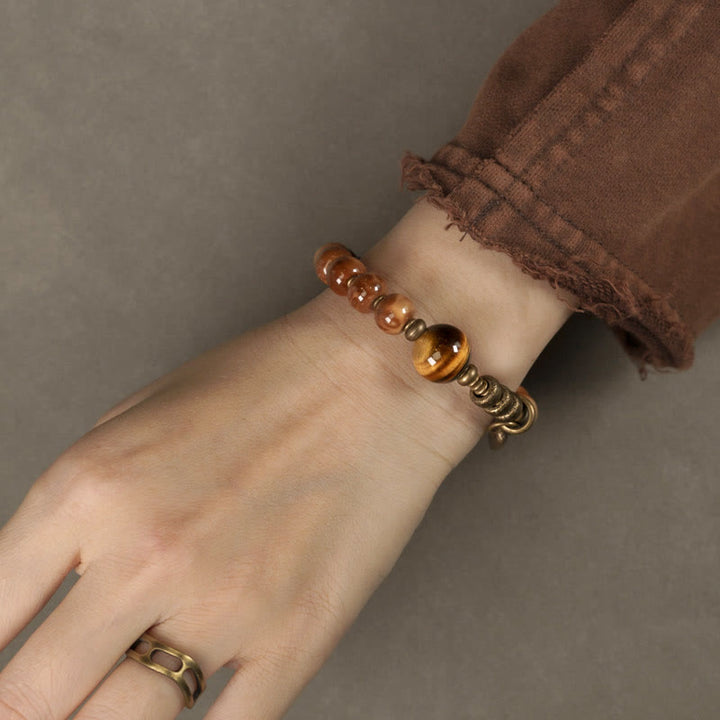Bracelet porte-bonheur en cuivre et obsidienne dorée avec Buddha Stones de Kuka et œil de tigre