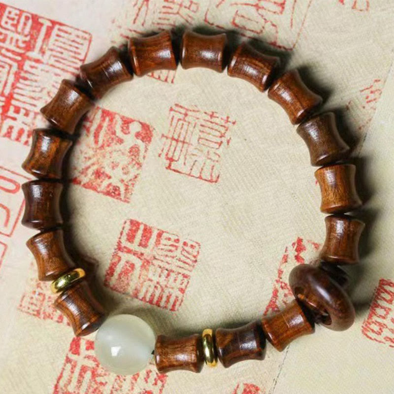 Bracelet de paix en bambou et bois de santal vert et ébène avec Buddha Stones