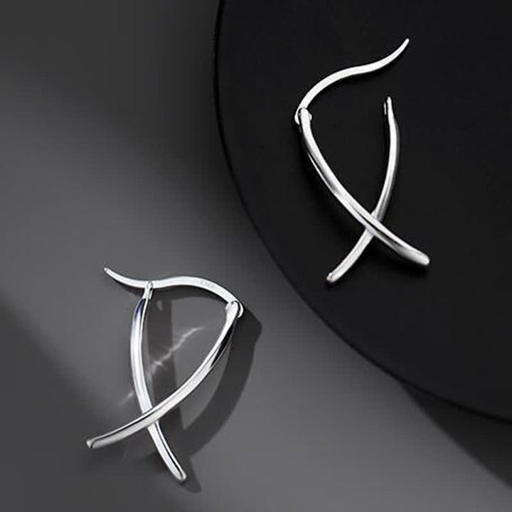 Boucles d'oreilles créoles porte-bonheur à motif géométrique croisé