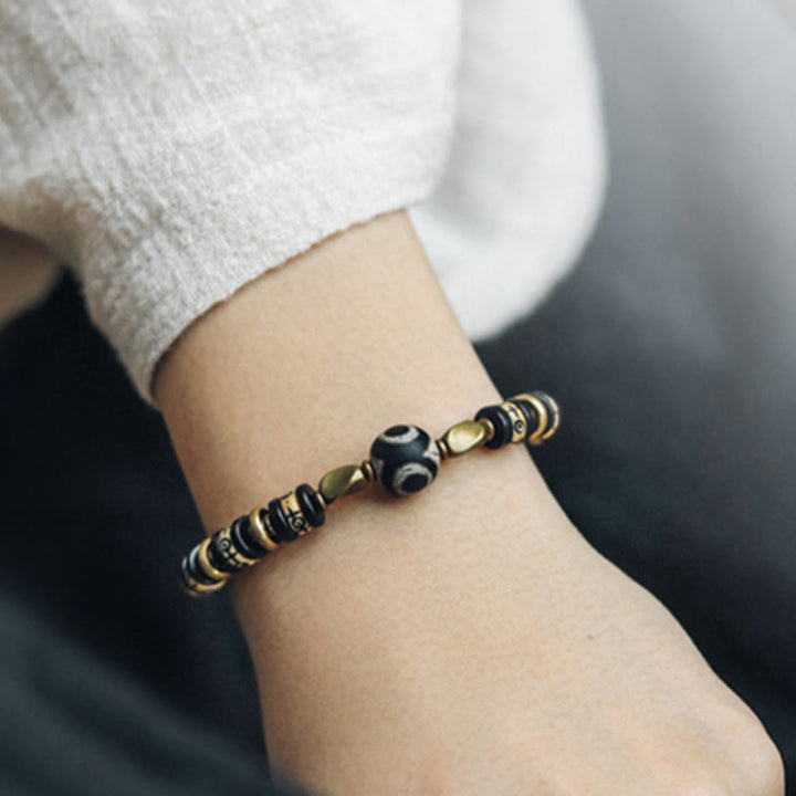 Bracelet de force en bois d'ébène et perles d'os tibétaines en Buddha Stones