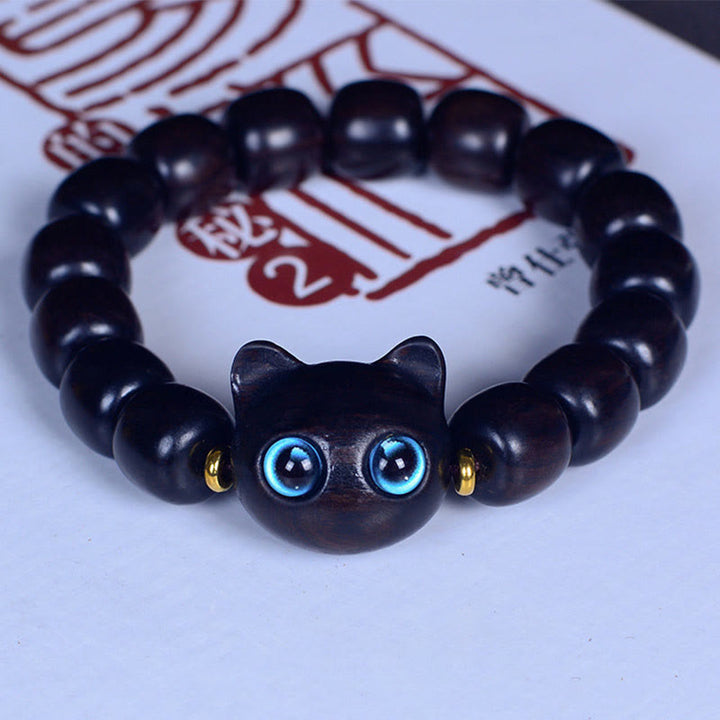 Bracelet Buddha Stones Bois d'ébène Verre Liuli Joli Chat Paix Équilibre - Perles en ébène 12 x 11 mm x 15 (tour de poignet 14-16 cm) - image 16