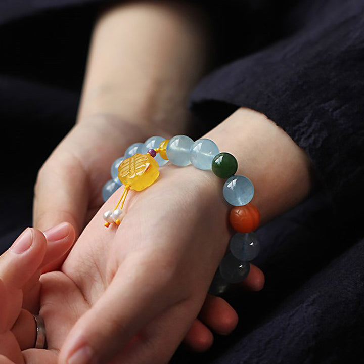 Bracelet de paix avec breloque en ambre et aigue-marine naturelle