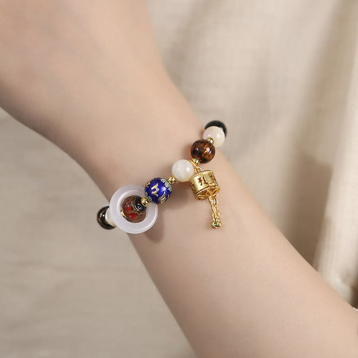 Buddha Stones Encens tibétain Cendres Verre Liuli Pierre Tridacna Pierre de Soleil Om Mani Padme Hum Bracelet à breloques pour roue de prière