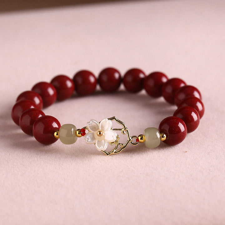 Bracelet de bénédiction en pierre de cinabre naturelle et jade Tridacna avec Buddha Stones