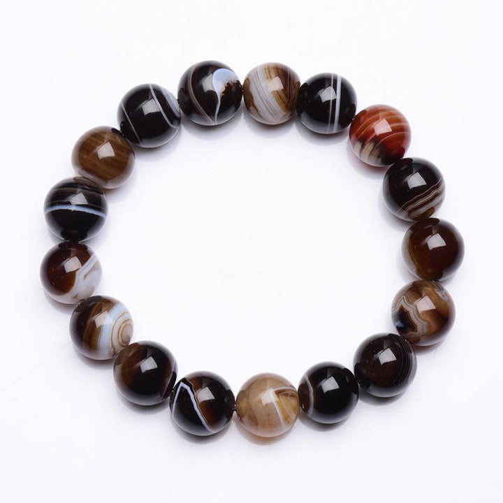 Bracelet de bonheur positif tibétain en sardonyx Buddha Stones